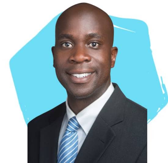 Dr. Nelson Akwari, Executive, The Boeing Company, in front of a light teal hexagon.